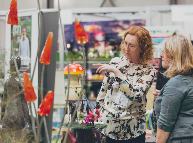 Buyers look at garden products at trade show