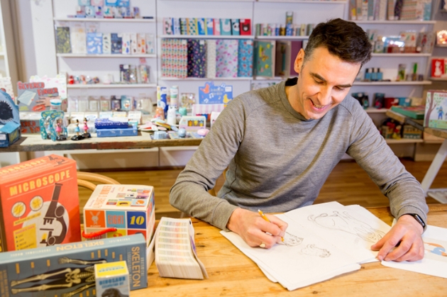 Nigel Biggs, CEO of Rex London sketches at a desk