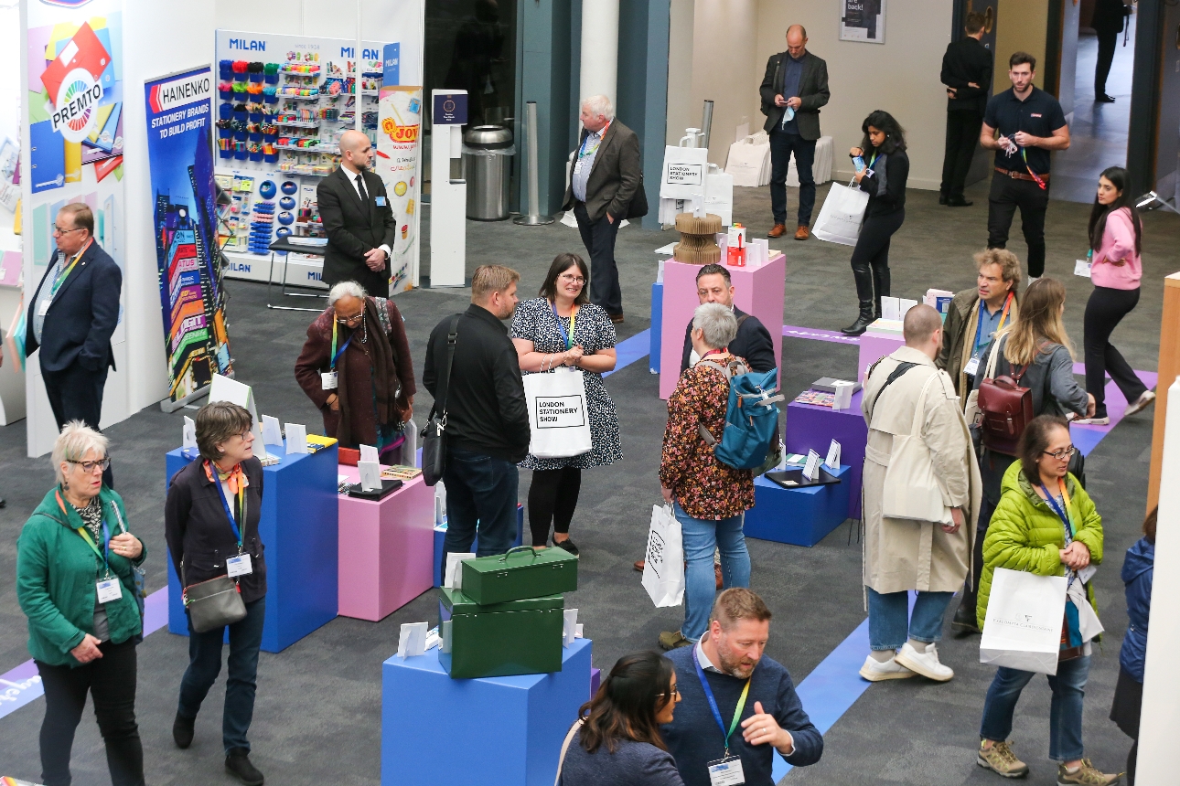 people walking about shell scheme of exhibition stands