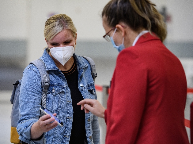 Girl entering trade show with a mask on