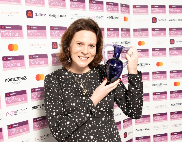 Hannah Dale from Wrendale holding everywoman award