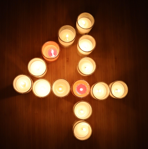 Lit candles in number four shape
