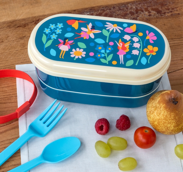 Lunch box with apple and cutlery 