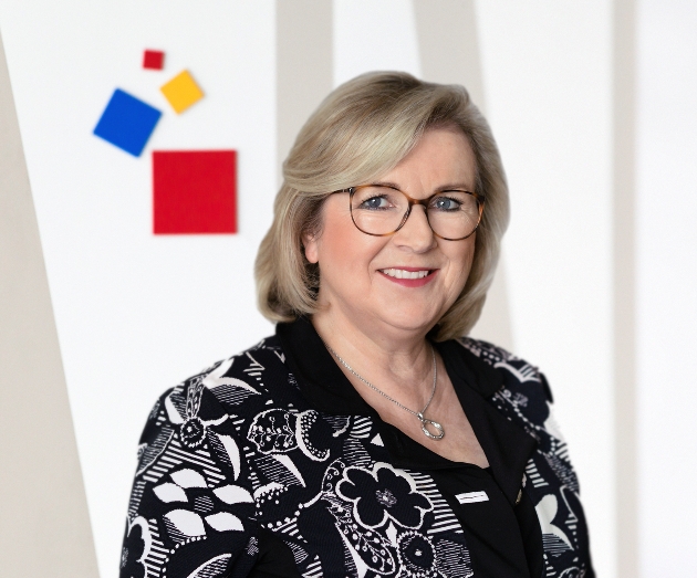 head shot of a greyhaired woman in glasses