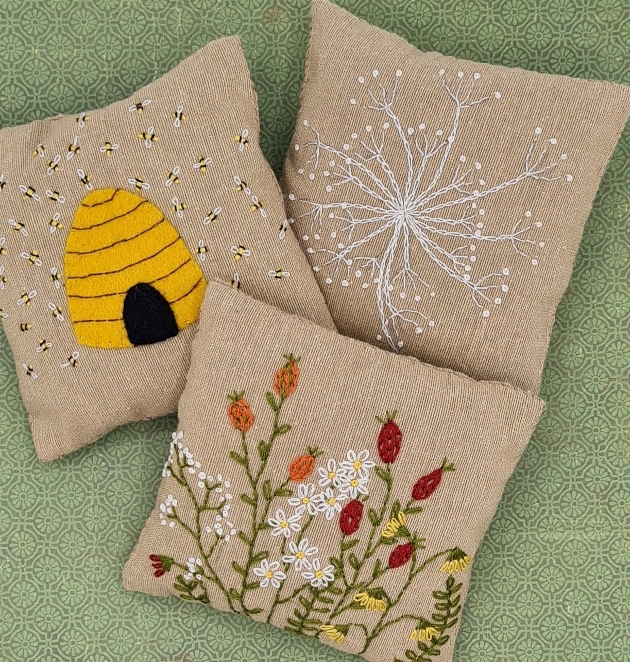 three brown hessian pillows with natural images