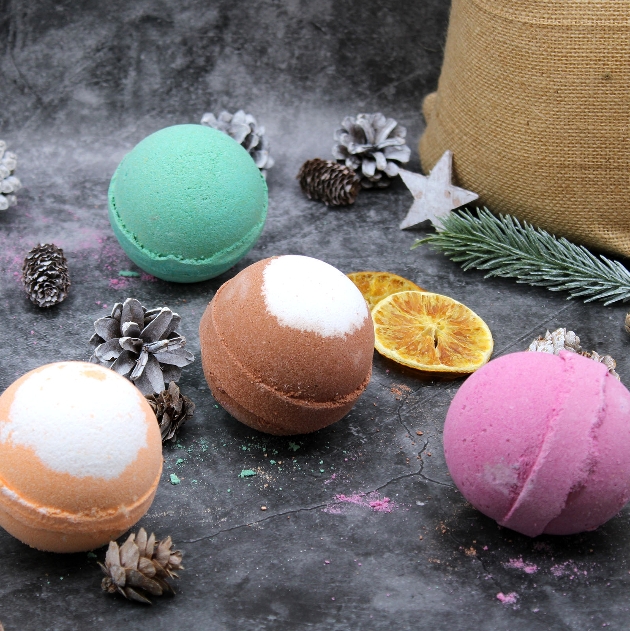 four bath bombs in different colours