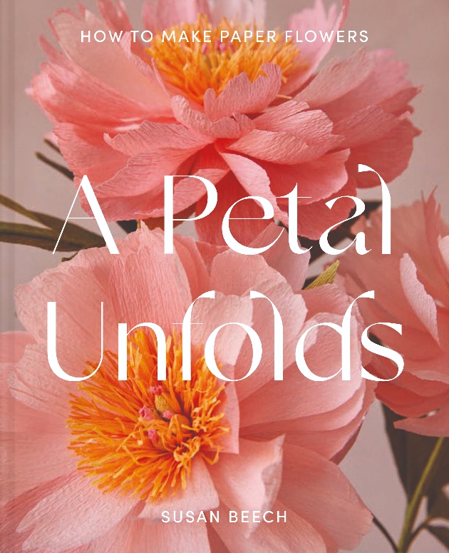 front cover of book featuring bright pink paper flowers