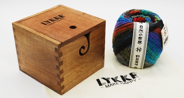 ball of yarn next to wooden box
