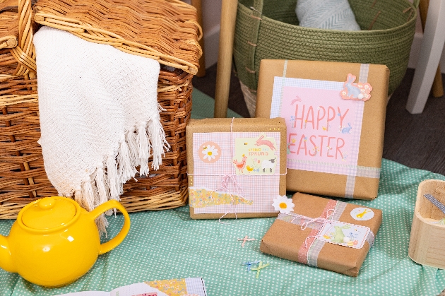 gifts wrapped in brown craft paper with happy easter craft bits added