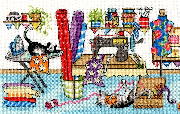 cross stitch scene of a sewing room with a naughty cat 
