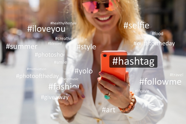 Woman using social media; concept of hashtag usage on social media platforms