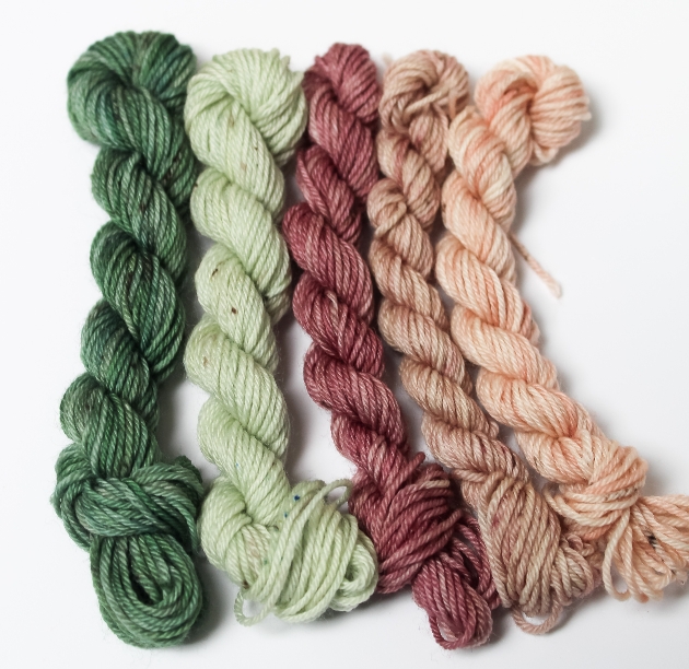 group of five crochet threads in pinks and greens