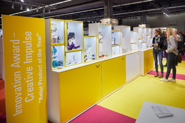yellow exhibition stands showcasing craft items