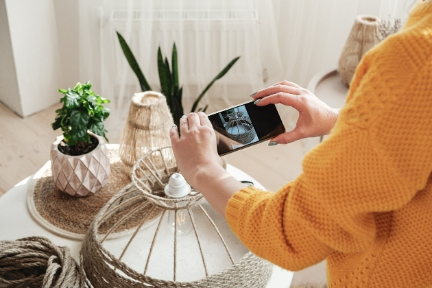 woman taking photo of macrame rope lampshade