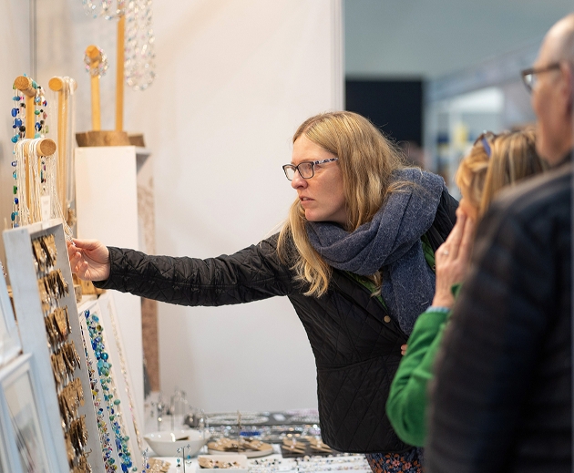 lady leaning in and looking at jewellery