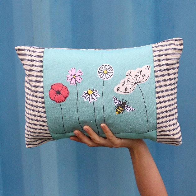 Floral embroidered blue cushion