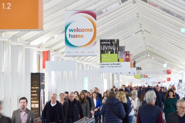 blurry image of people walking in exhibition hall