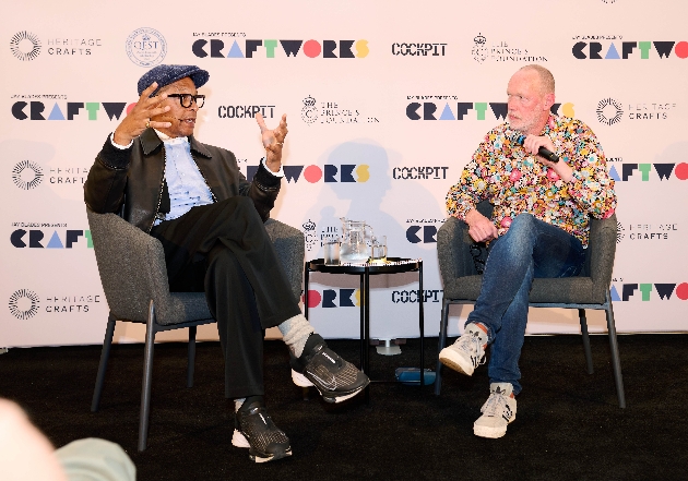 Two men having discussion on stage