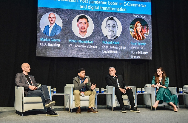 panel of four people on stage in discussion