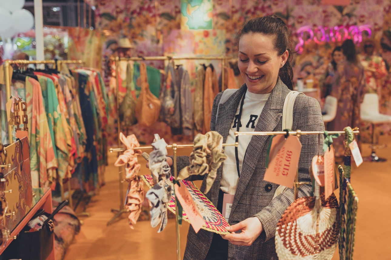 buyer looking at hair accessories at Spring Fair