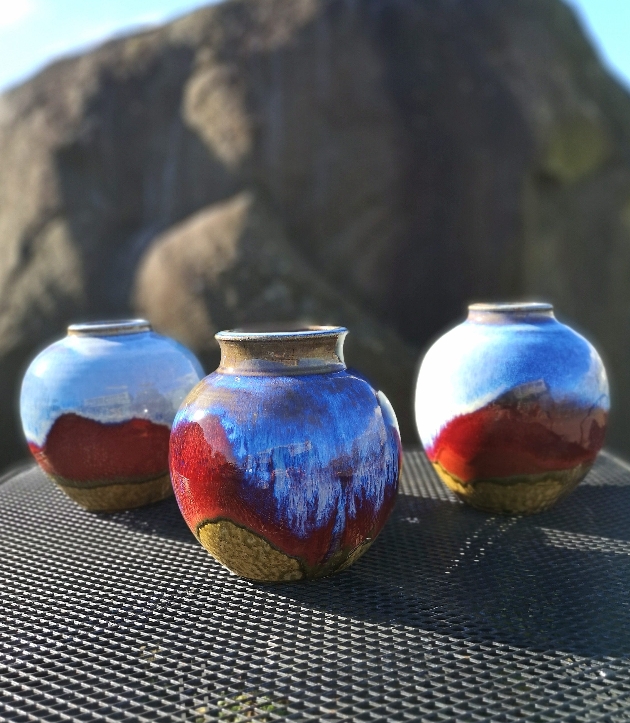 three glazed pottery vases