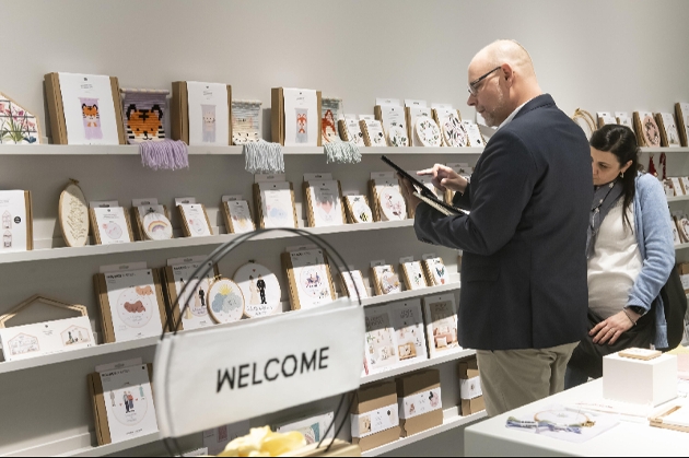 man taking orders on his tablet at a trade show