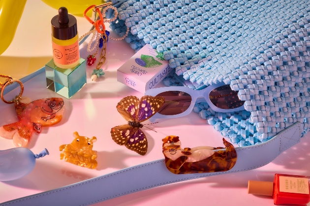 Collection of consumer items including sunglasses hair clips and a key ring