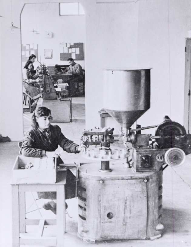 historical black and white image of machine making paints