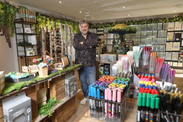 man standing in craft shop
