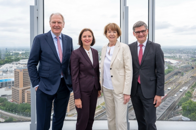 group of four  business men and women