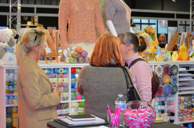 three ladies chatting at trade show