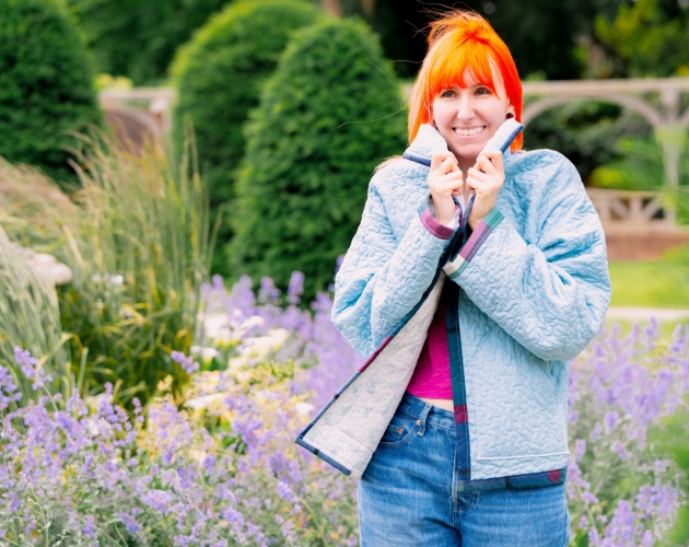 lady standing amongst lavender wearing quilted jacket