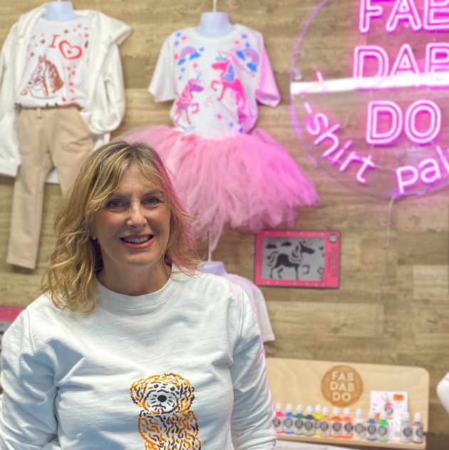lady standing with craft kits