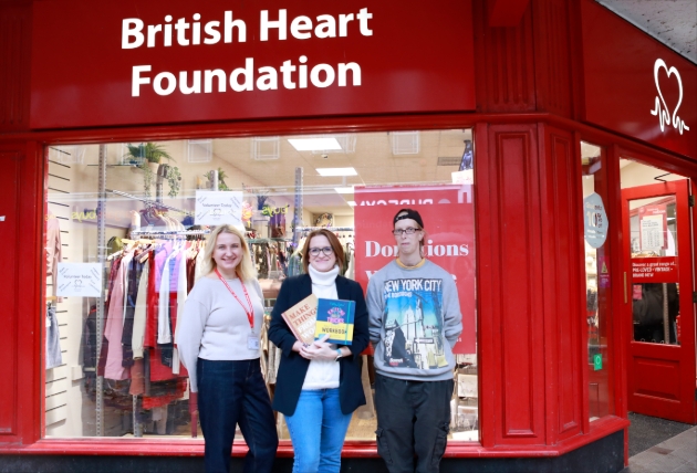 three ladies outside charity shop