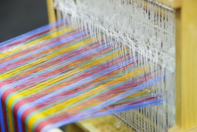 close up of weaving device