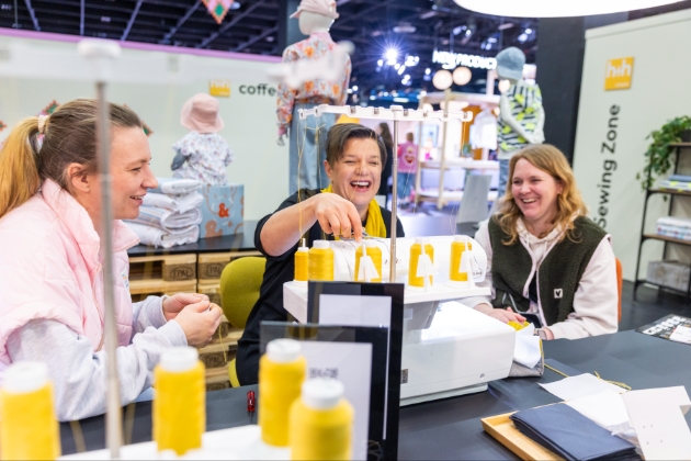 the ladies threading a sewing machine