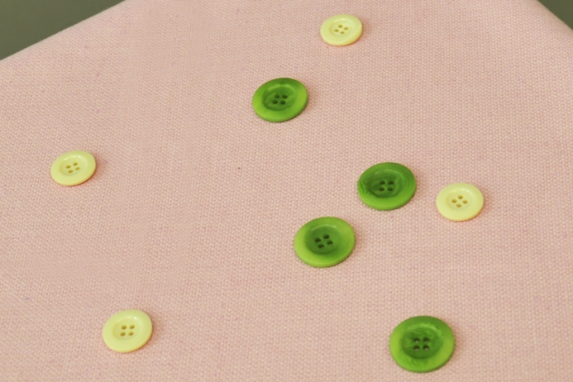 Beige fabric and green buttons